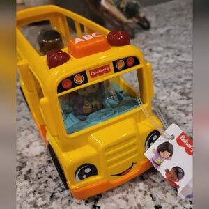 NWT Fisher-Price Musical Yellow School Bus Toy